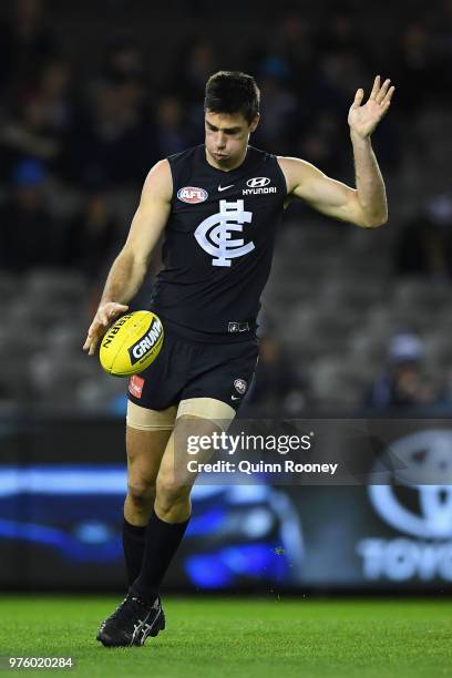 Matthew Kreuzer of the Blues kicks during the round 13 AFL match between the Carlton Blues and the Fremantle Dockers at Etihad Stadium on June 16,...