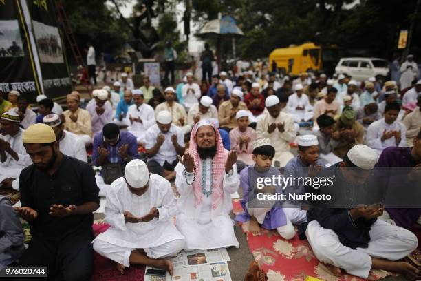 Dhaka, Bangladesh. Bangladeshi Muslim devotees take part in Eid-ul-Fitr prayer on a road near National Eidgah premises in Dhaka, Bangladesh on June...