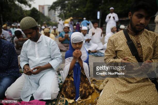 Dhaka, Bangladesh. Bangladeshi Muslim devotees take part in Eid-ul-Fitr prayer on a road near National Eidgah premises in Dhaka, Bangladesh on June...