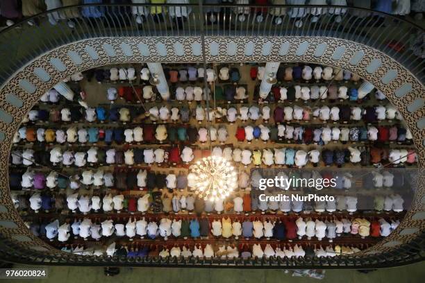 Dhaka, Bangladesh. Bangladeshi Muslim devotees take part in Eid-ul-Fitr prayer at a mosque in Dhaka, Bangladesh on June 16, 2018. Muslims around the...