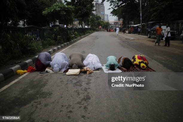 Dhaka, Bangladesh. Bangladeshi Muslim devotees take part in Eid-ul-Fitr prayer on a road near National Eidgah premises in Dhaka, Bangladesh on June...