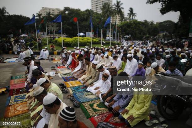 Dhaka, Bangladesh. Bangladeshi Muslim devotees take part in Eid-ul-Fitr prayer on a road near National Eidgah premises in Dhaka, Bangladesh on June...