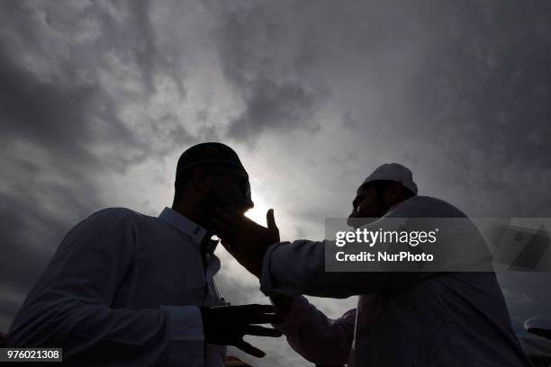 Sri Lankan Muslims greet and embrace each other after attending Eid al Fitr prayers at Galle Face, Colombo, Sri Lanka on Saturday June 2018. Eid...