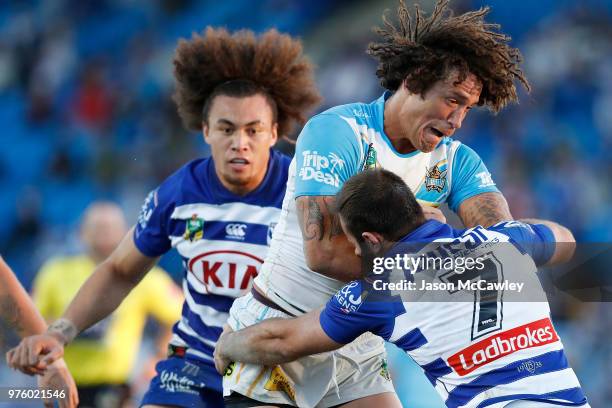 Kevin Proctor of the Titans is tackled during the round 15 NRL match between the Canterbury Bulldogs and the Gold Coast Titans at Belmore Sports...