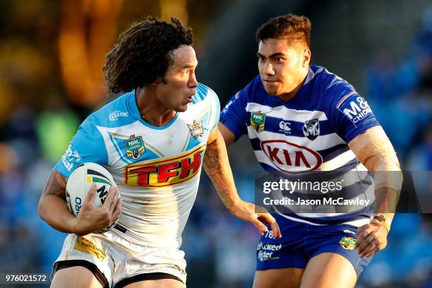 Kevin Proctor of the Titans runs the ball during the round 15 NRL match between the Canterbury Bulldogs and the Gold Coast Titans at Belmore Sports...