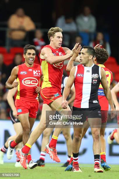 Tom Lynch of the Suns celebrates a goal during the round 13 AFL match between the Gold Coast Suns and the St Kilda Saints at Metricon Stadium on June...