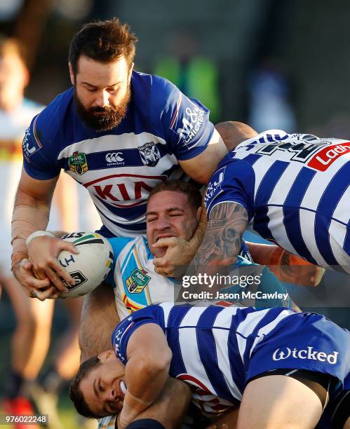 Brenko Lee of the Titans is tackled by Aaron Woods of the Bulldogs during the round 15 NRL match between the Canterbury Bulldogs and the Gold Coast...