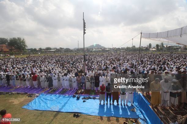 Muslims perform Eid al-Fitr prayer during the Eid al-Fitr holiday in Srinagar, the summer capital of Indian controlled Kashmir, on June 16, 2018.