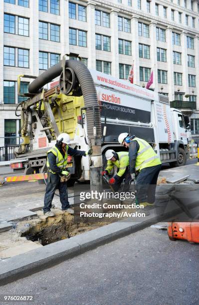 Suction excavator operating on Farringdon Road. London UK.
