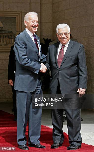 In this handout image provided by the Palestinian Press Office , US Vice President Joe Biden and Palestinian President Mahmoud Abbas shake hands...