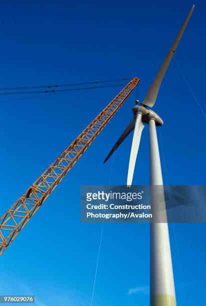 The nose cone of a giant Enercon wind turbine is installed on to the hub Worksop United Kingdom Worksop United Kingdom December 2008.