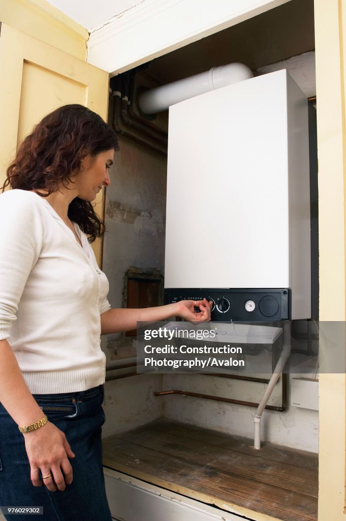 Woman testing a domestic Boiler