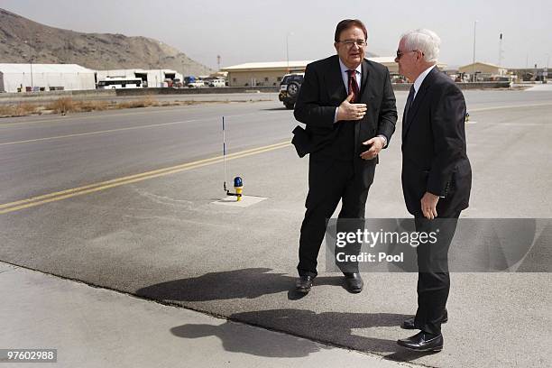 Afghan Defense Minister Abdul Rahim Wardak and US Secretary of Defense Robert Gates chat at Kabul International Air Field after they finished touring...