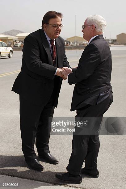 Afghan Defense Minister Abdul Rahim Wardak and US Secretary of Defense Robert Gates shakes hands at Kabul International Air Field after they finished...