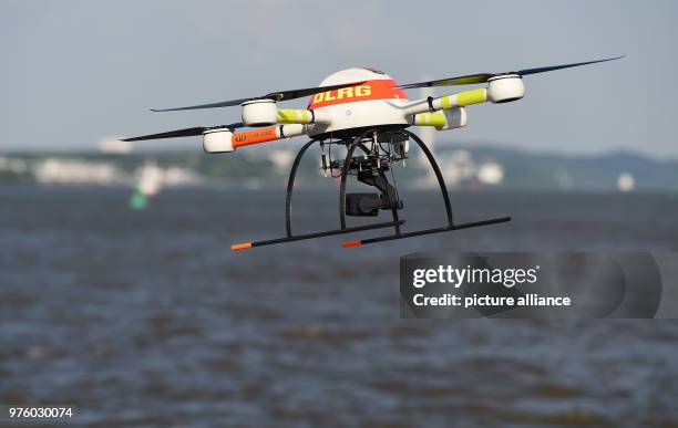 May 2018, Jork, Germany: A drone of the German Life Rescue Society is equipped with a thermal imaging camera, for practice purposes on a beach on the...