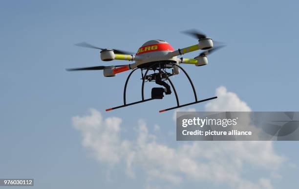 May 2018, Jork, Germany: A drone of the German Life Rescue Society is equipped with a thermal imaging camera, for practice purposes on a beach on the...