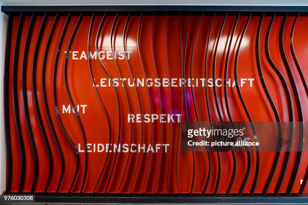March 2018, Germany, Munich: A wall in the foyer of a building reads 'Teamgeist' , 'Leistungsbereitschaft' , 'Mut' , 'Respekt' , 'Leidenschaft' , and...