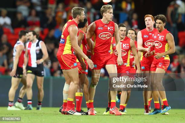 Tom Lynch of the Suns celebrates a goal during the round 13 AFL match between the Gold Coast Suns and the St Kilda Saints at Metricon Stadium on June...