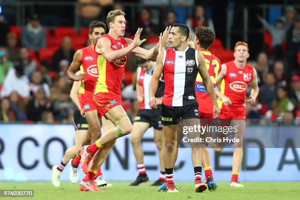 Tom Lynch of the Suns celebrates a goal during the round 13 AFL match between the Gold Coast Suns and the St Kilda Saints at Metricon Stadium on June...