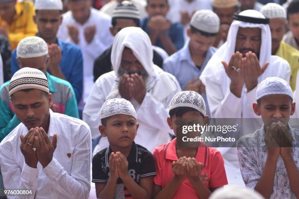 Indian Muslim kids along with elders offer prayer during Eid-al-Fitr in Dimapur, India north eastern state of Nagaland on Saturday, June 16,...