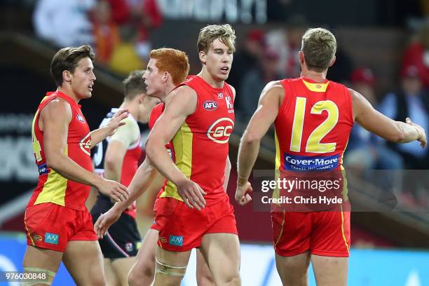 Tom Lynch of the Suns celebrates a goal during the round 13 AFL match between the Gold Coast Suns and the St Kilda Saints at Metricon Stadium on June...