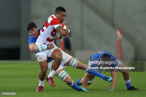 Lomano Lava Lemeki of Japan is tackled by Sebastian Negri of Italy during the rugby international match between Japan and Italy at Noevir Stadium...