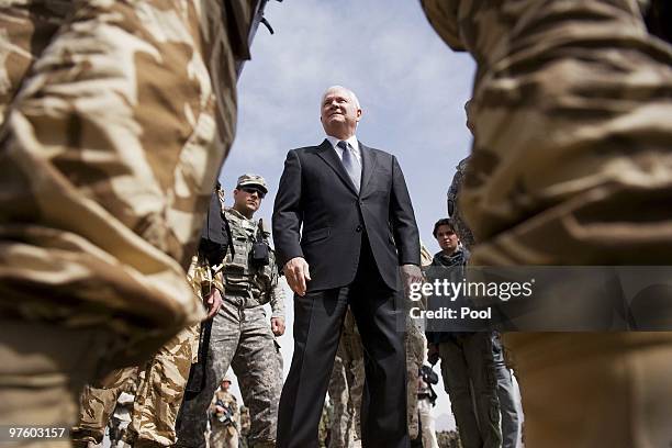 Secretary of Defense Robert Gates inspects troops as he tours Camp Blackhorse training grounds on March 10, 2010 in Kabul, Afghanistan. During his...