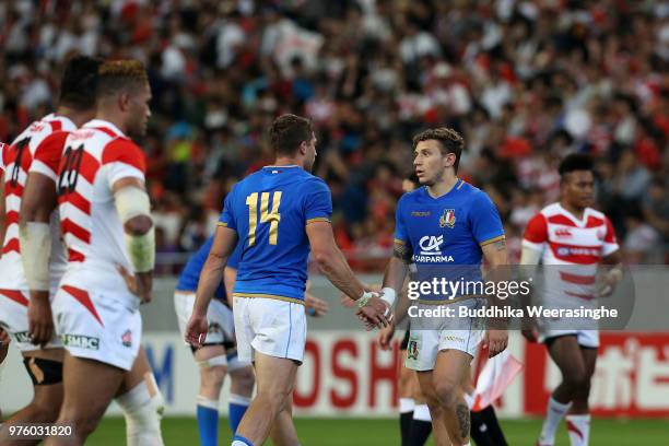 Matteo Minozzi and Tommaso Benvenuti of Italy celebrate their 25-22 victory in the rugby international match between Japan and Italy at Noevir...