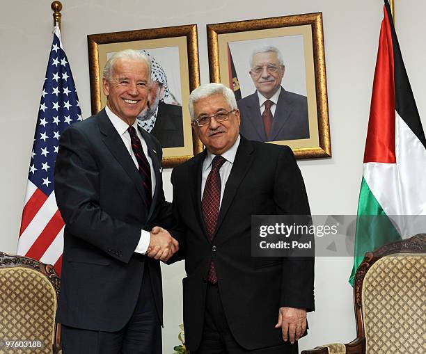 Vice President Joe Biden and Palestinian President Mahmoud Abbas shake hands during their meeting at the Presidential compound on March 10, 2010 in...