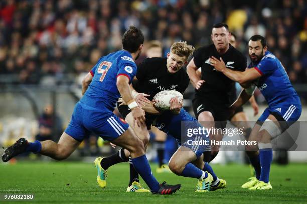 Damian McKenzie of the All Blacks makes a break during the International Test match between the New Zealand All Blacks and France at Westpac Stadium...