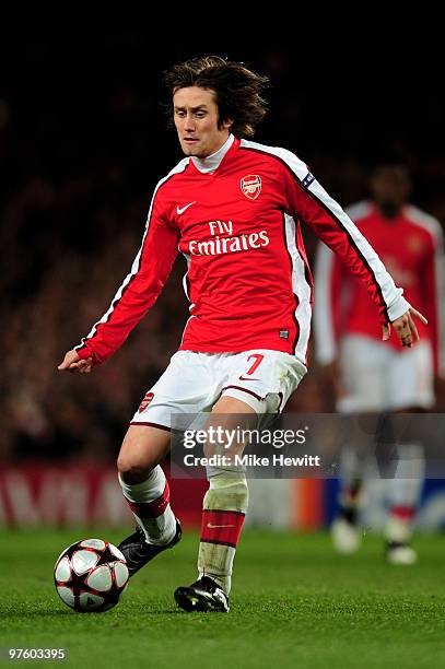Tomas Rosicky of Arsenal passes the ball during the UEFA Champions League round of 16 match between Arsenal and FC Porto at the Emirates Stadium on...