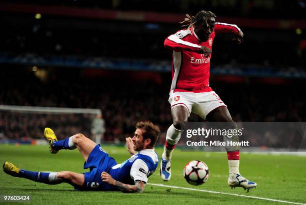 Bacary Sagna of Arsenal goes past Raul Meireles of Porto during the UEFA Champions League round of 16 match between Arsenal and FC Porto at the...