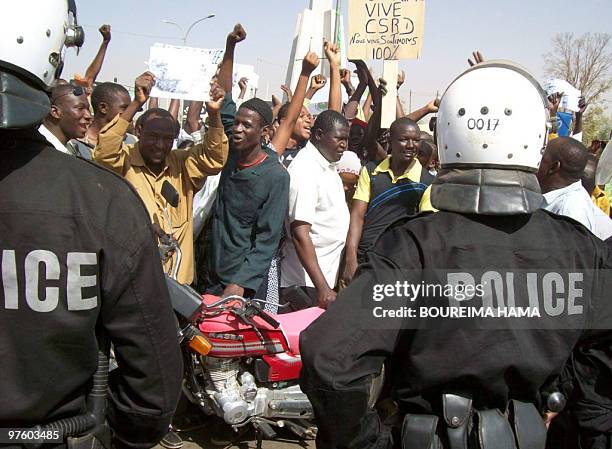 People attend a rally in Niger's capital Niamey on February 20, 2010 in support of their new military rulers after a coup ousted the strongman of the...