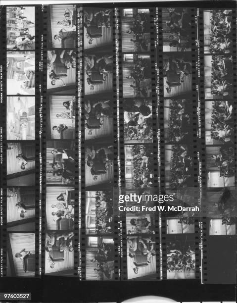 Contact sheet shows various images from a union meeting of writers and staffers from the Village Voice newspaper, New York, New York, July 8, 1982.
