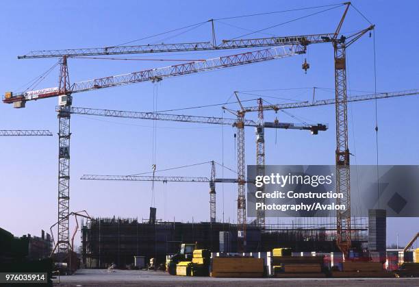 Venice flood scheme Giant gate foundation caissons being cast in the construction yard with a rank of tower cranes and concrete pumps, Venezia, Italy.