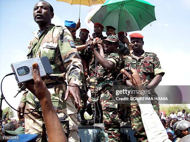 People greet members of the military junta during a rally in Niger's capital Niamey on February 20, 2010 in support of their new military rulers...