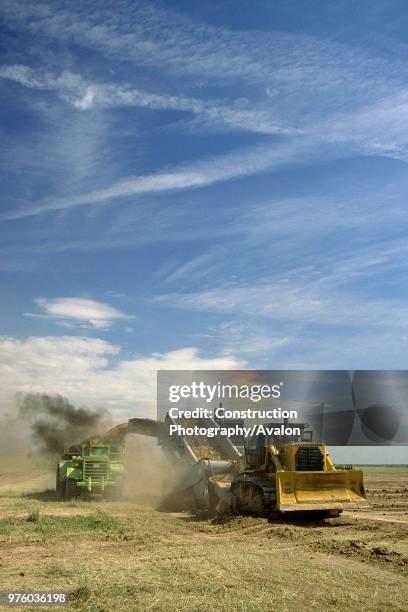 Bulldozer removing topsoil.