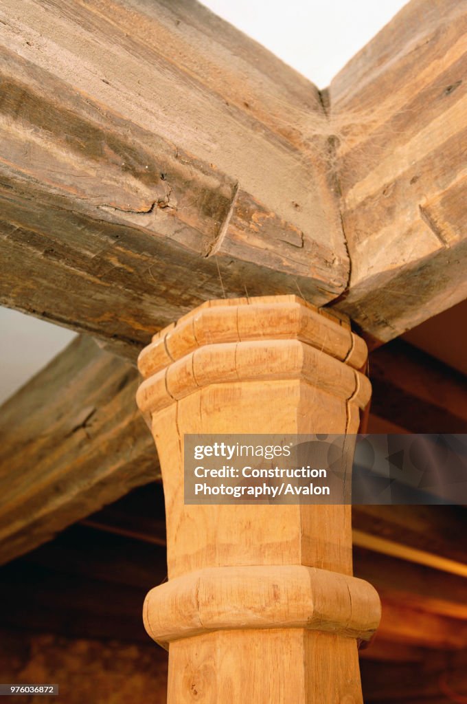 The Merchant's House in Shepton Mallet, Somerset. Buildings at risk register. A new carved wooden pillar supporting original beams.