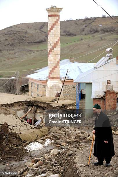 An elderly man looks at the devastation caused by an earthquake in the eastern Turkish village of Yukari Demirciler, on March 9, 2010. Often...