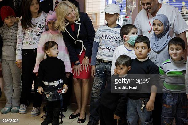 Jill Biden , wife of US Vice President Joe Biden, poses with young Palestinian patients during her visit to the Augusta Victoria hospital on March...