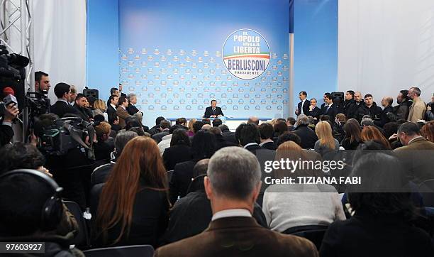 Italian Prime Minister and President of the Popolo della Liberta ruling party Silvio Berlusconi speaks during a press conference on March 10, 2010 at...