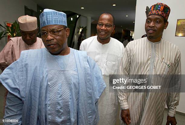 Former Nigerian President Ibrahim Babangida and Commission President of the Economic Community of West African States Mohamed Ibn Chambas with an...