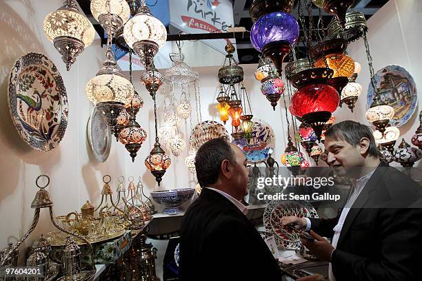 Visitor considers buying a dagger in a basaar at the Turkish stand at the ITB Berlin travel trade show on March 10, 2010 in Berlin, Germany. The ITB,...