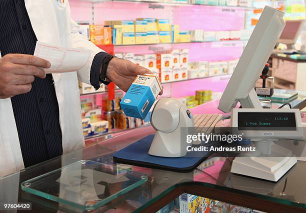 Pharmacist scans at the cash desk a package of 'Valoron N retard' pills on March 10, 2010 in Berlin, Germany. German Health Minister Philipp Roesler...