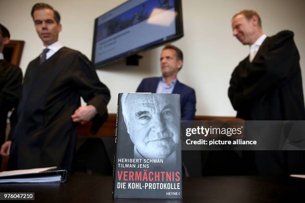 May 2018, Germany, Cologne: Lawyers standing behind the book about former Chancellor Kohl "Vermächtnis - Die Kohl Protokolle" by journalist and...