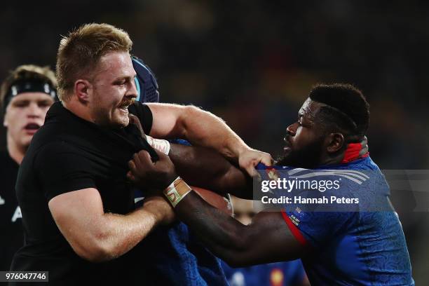 Sam Cane of the All Blacks fights with Dany Priso of France during the International Test match between the New Zealand All Blacks and France at...