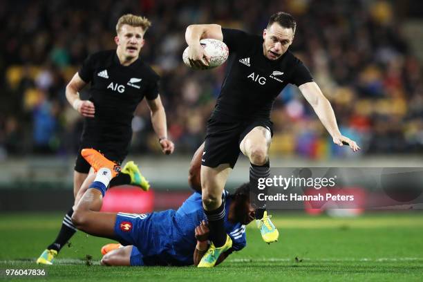 Ben Smith of the All Blacks makes a break during the International Test match between the New Zealand All Blacks and France at Westpac Stadium on...