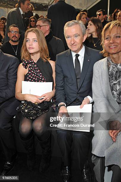 Natalia Vodianova, Bernard Arnault and Helene Arnault attend the Louis Vuitton Ready to Wear show as part of the Paris Womenswear Fashion Week...