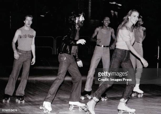 Mick Jagger and Jerry Hall roller skating circa 1975 in New York.