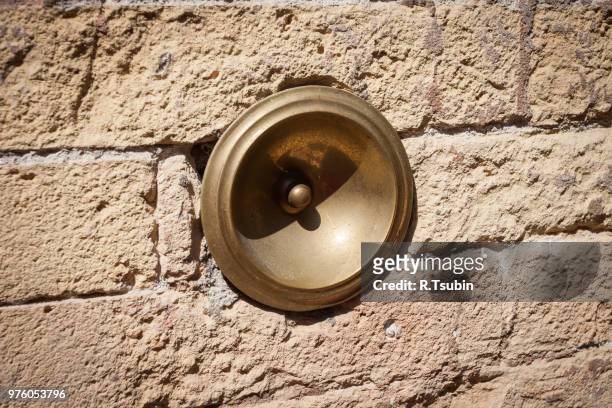 antique bell calling porter, on the wall, italy - door bell fotografías e imágenes de stock